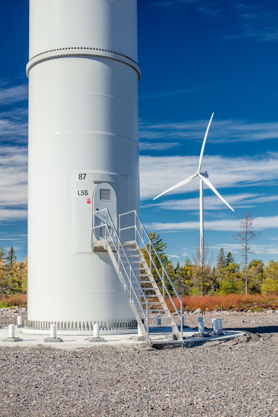 Henvey Inlet wind turbine base - Blue sky and forest background