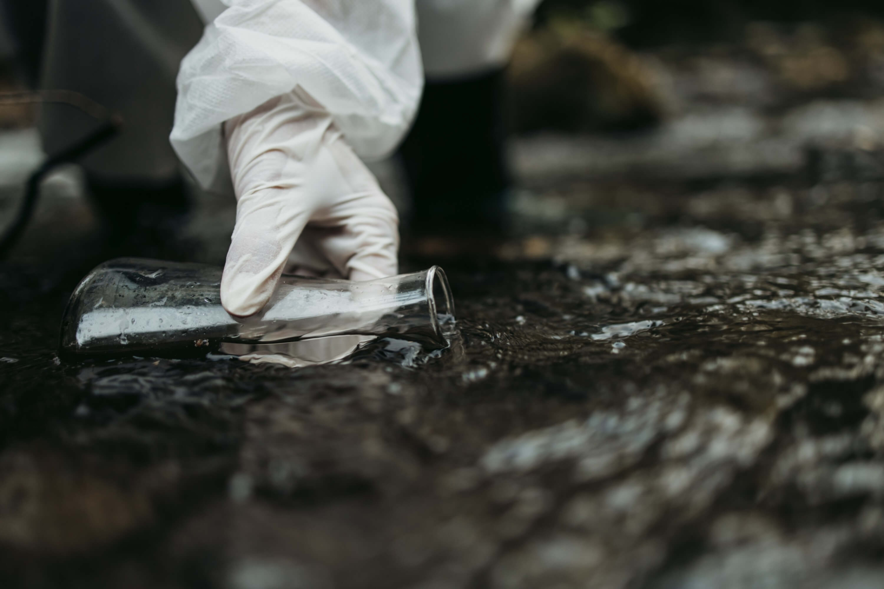 Environment Studies - Person taking samples in river
